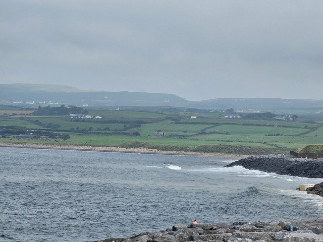 high tide so no surfers in the water but a bit of a wave breaking at the north end of the beach